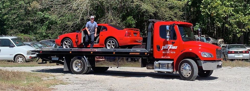Red Tire Pros Tow truck